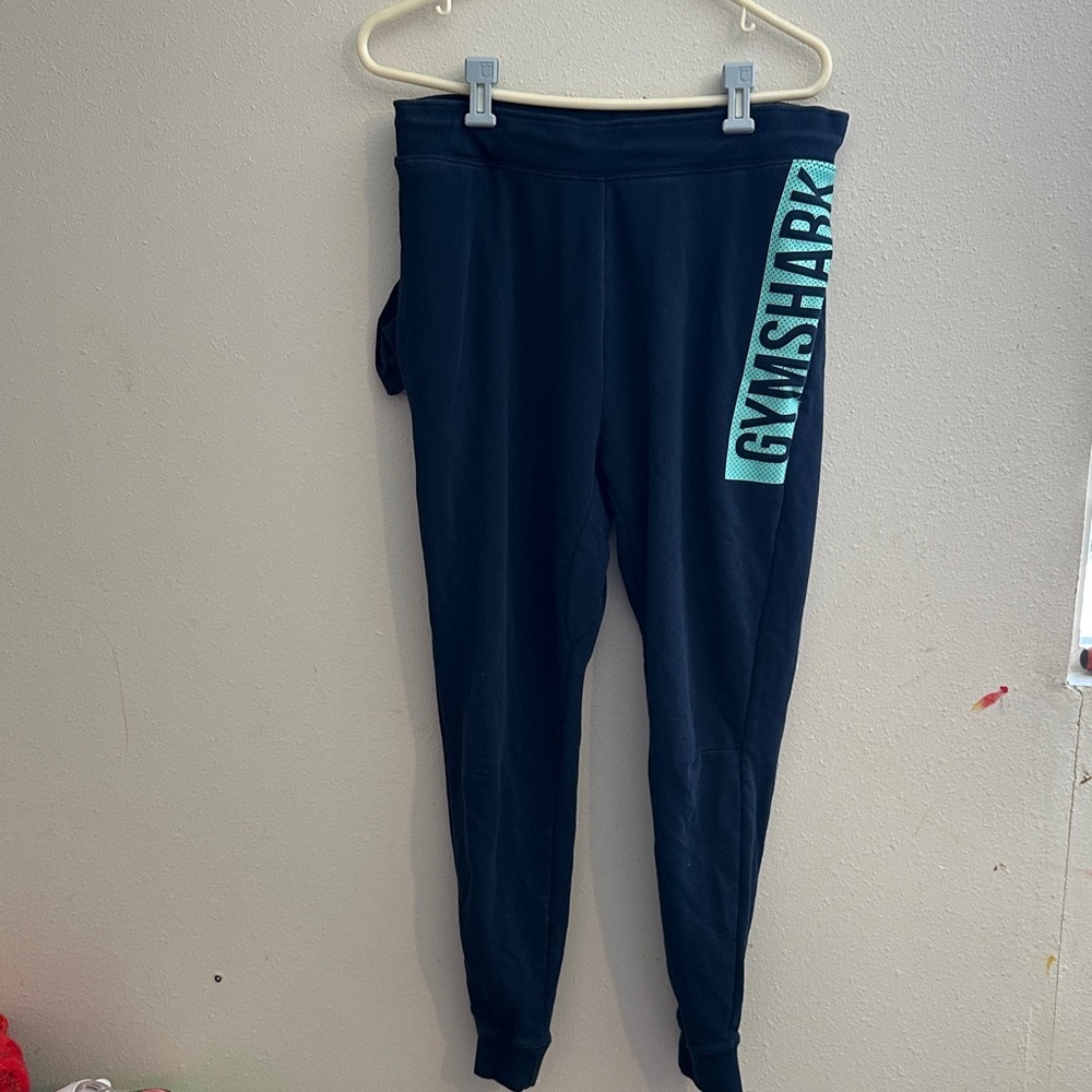 Gymshark men’s navy sweats
with Teal Logo Panel